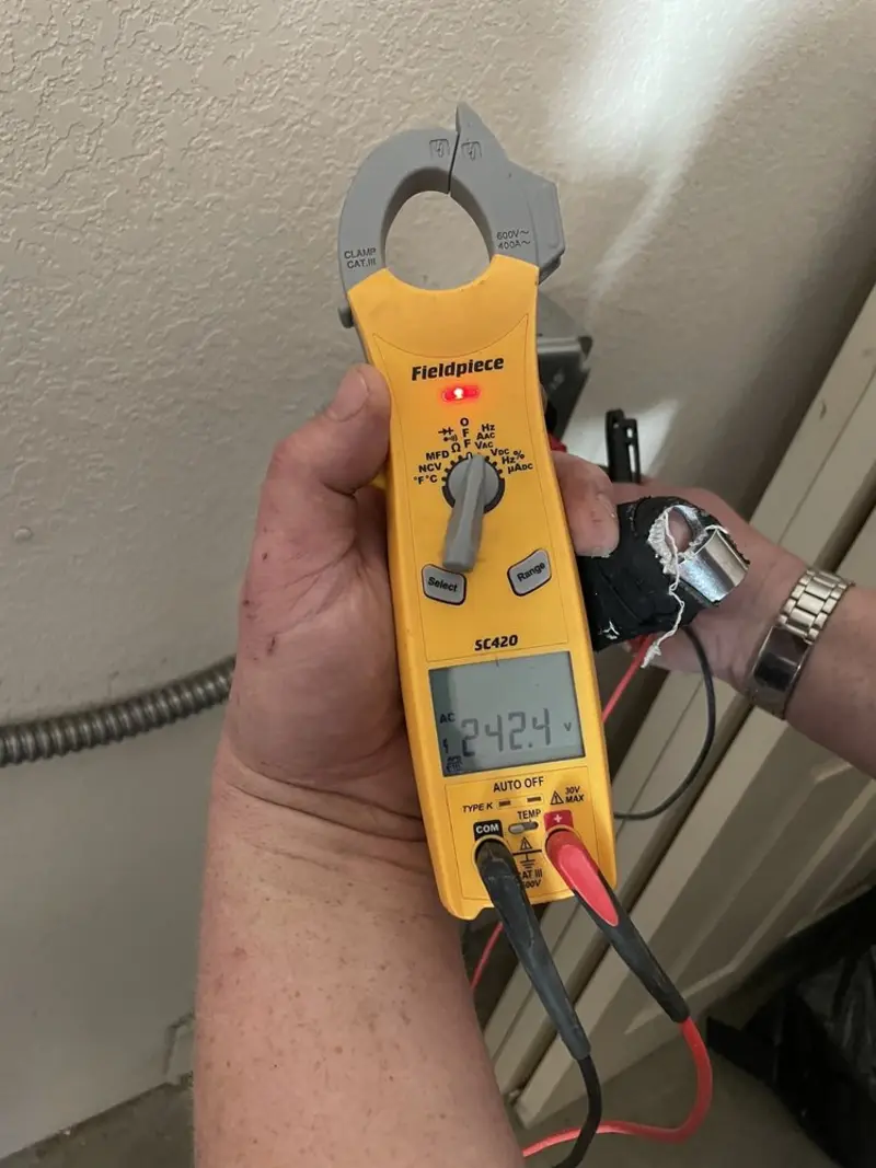 Voltage testing with clamp meter during Circuit Breaker Repair in Decatur
